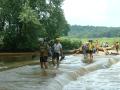 Jim Tretter, Don Feeney, Tim Chilton, and Melissa Hall (partially hidden behind Tim) make their way across the Salt River on the flooded culvert on Drydock Road.
