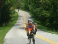 Larry Preble cruises up one of the hills on KY 395 in Anderson County on his recumbent, with Bill Pustow just coming into view at the bottom of the climb.